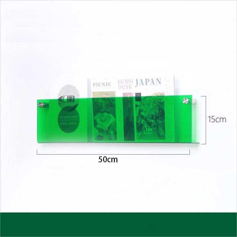 A translucent green floating acrylic magazine holder with three compartments each holding different publications