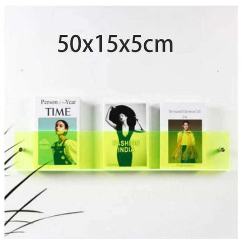 Lime green floating acrylic magazine holder with three slots holding fashion magazines made of acrylic material