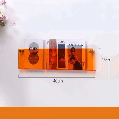Orange translucent floating acrylic magazine holder with two silver mounting screws for easy wall display