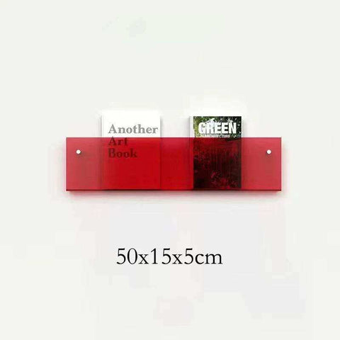 A sleek floating acrylic magazine holder in red with two compartments holding books mounted on the wall