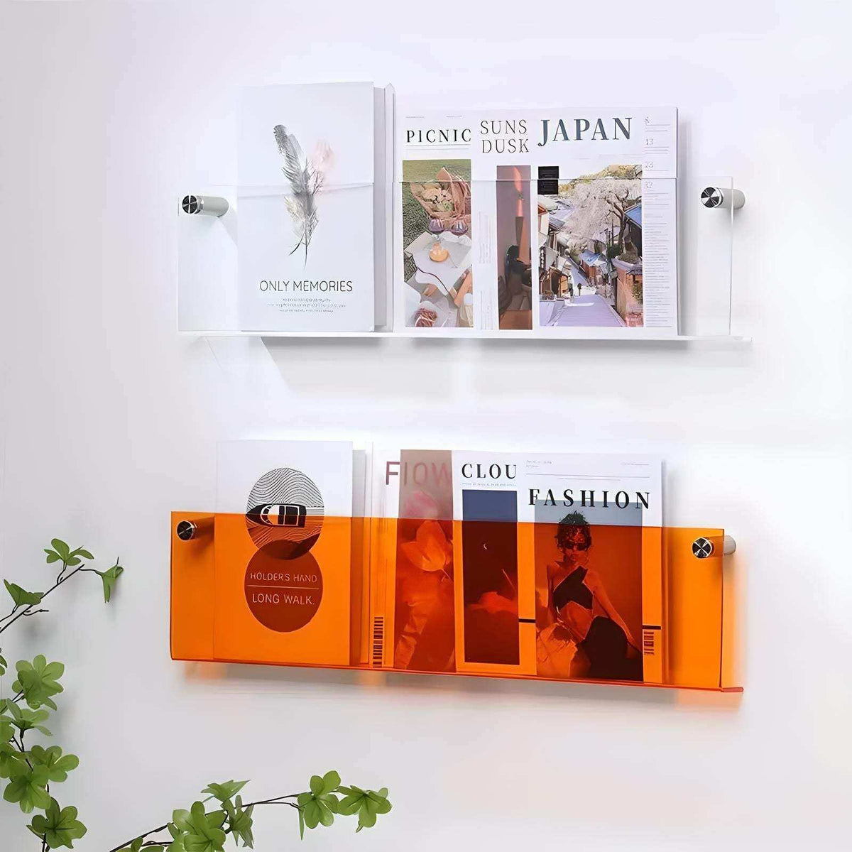 Floating acrylic magazine holders in clear and vibrant orange acrylic with silver-toned metal fasteners