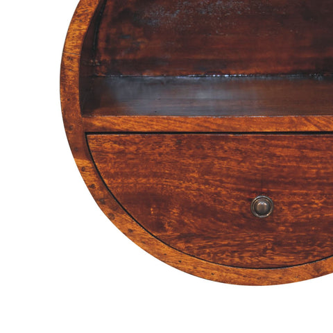 Antique oval wooden desk drawer with dark brown finish and round metal knob on floating circle chestnut bedside table