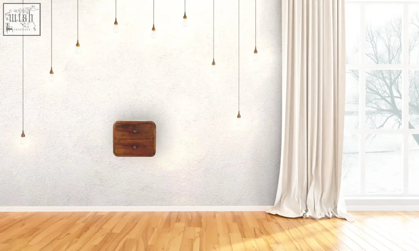 A floating mini chestnut wooden nightstand with two drawers and round knobs in warm brown finish wall-mounted