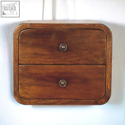 Vintage-style floating mini chestnut bedside table with two wooden drawers and round metallic knobs in warm brown finish