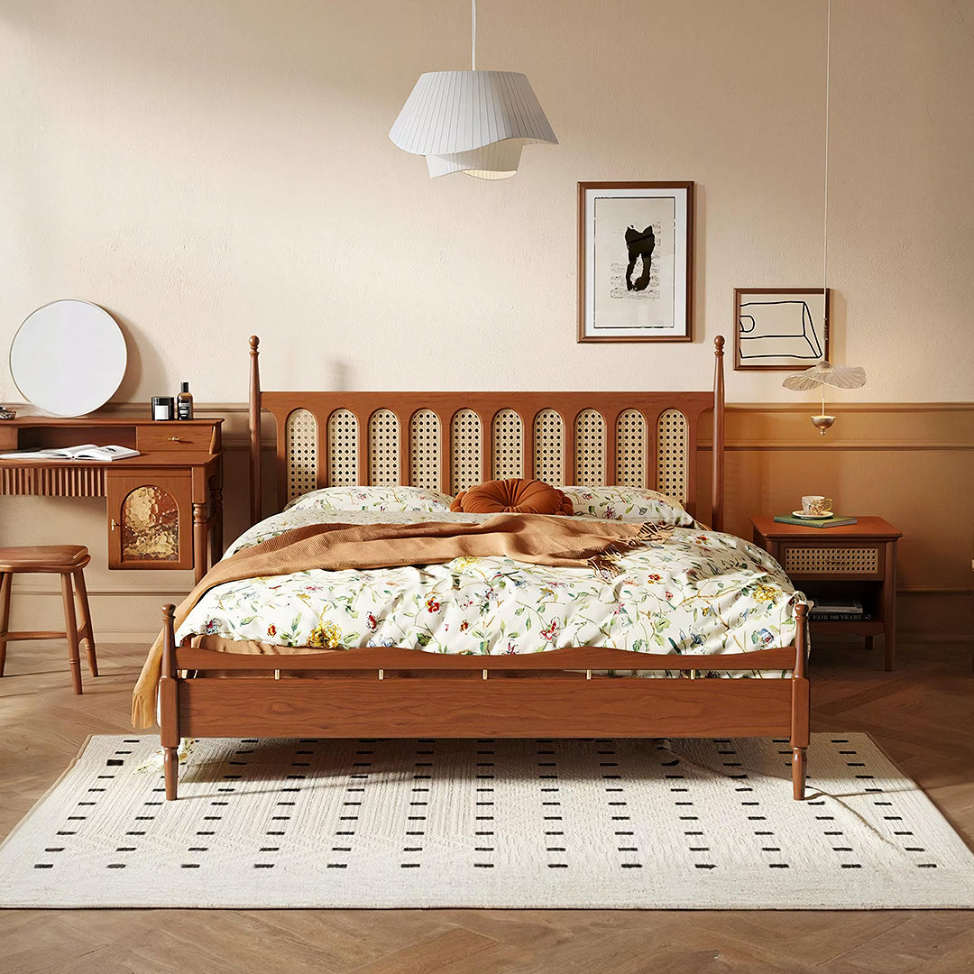 Wooden flora king size bed in cherry wood with woven cane headboard and floral pastel bedding