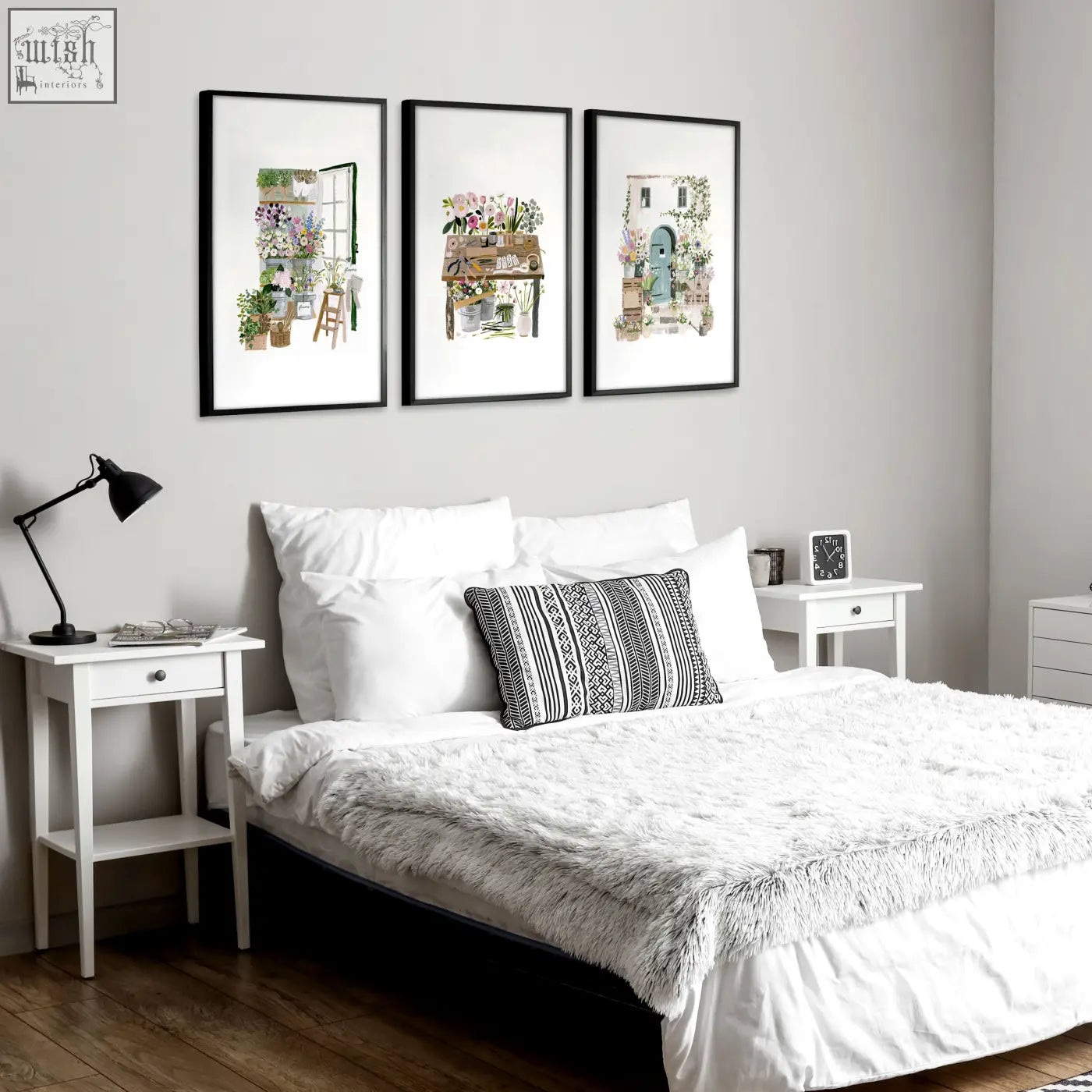 Black-framed floral art illustrated prints set of 3 hanging above bed perfect for country cottage wall decor