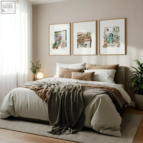 A cozy bed with beige and brown bedding and a dark green throw complements country cottage floral art illustrated prints