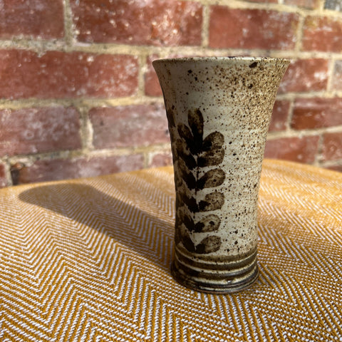 Floral ceramic vase with speckled finish dark brown vertical leaf pattern flared rim and ridged base