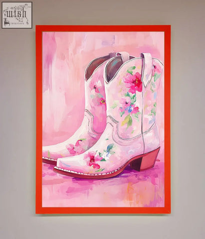 A vibrant pink floral cowboy boots framed poster in a bold red frame perfect for western decor