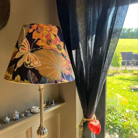 Floral midnight velvet handmade empire lampshade with vibrant orange and yellow floral butterfly pattern on dark background