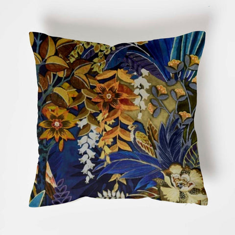 Floral midnight velvet throw cushion with vibrant orange gold white flowers and deep blue foliage on velvet fabric