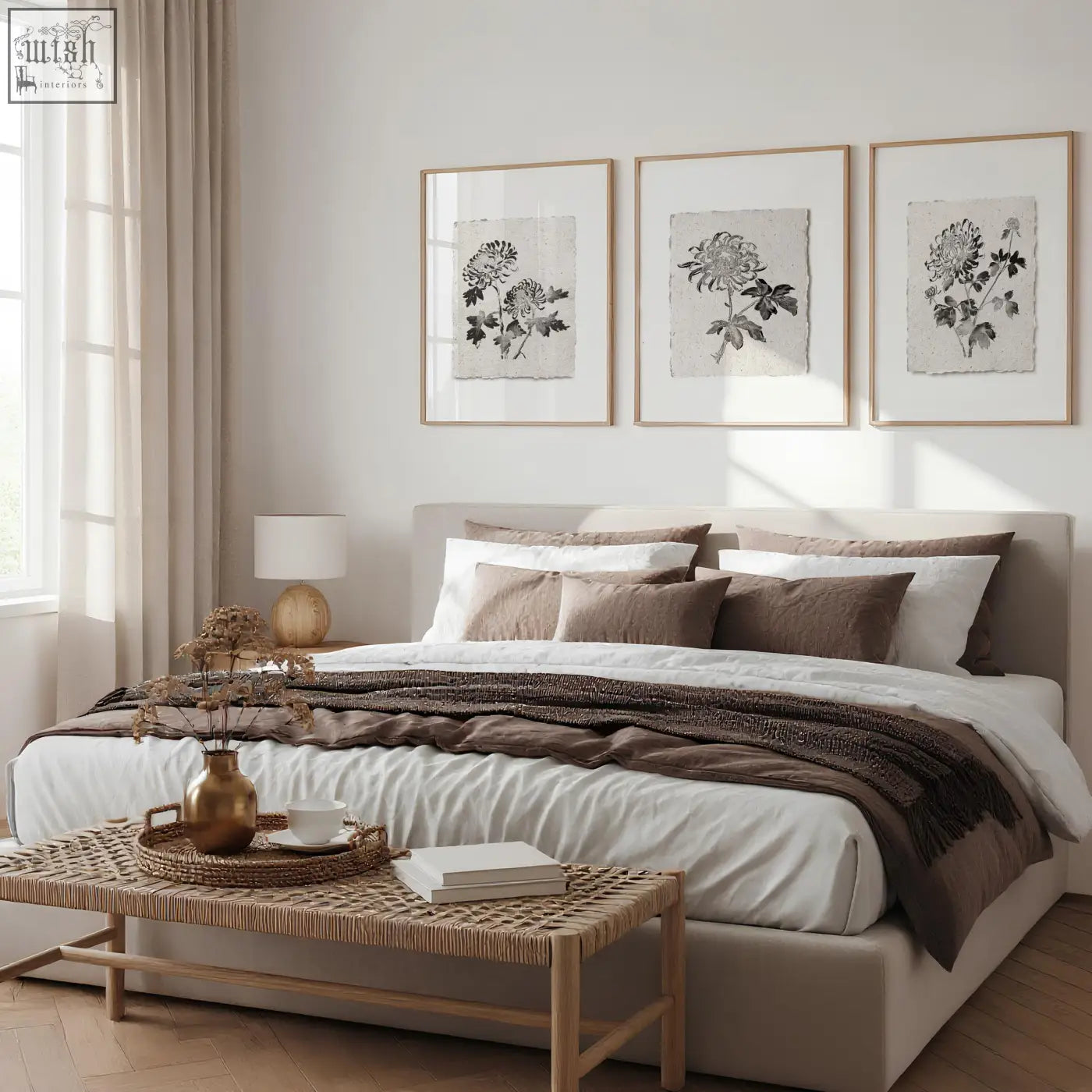 Beige upholstered bed with white and brown pillows and a brown throw in a french country botanical floral print room