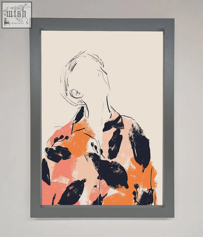 A floral thinker framed wall art featuring an abstract orange and black figure in a sleek gray frame