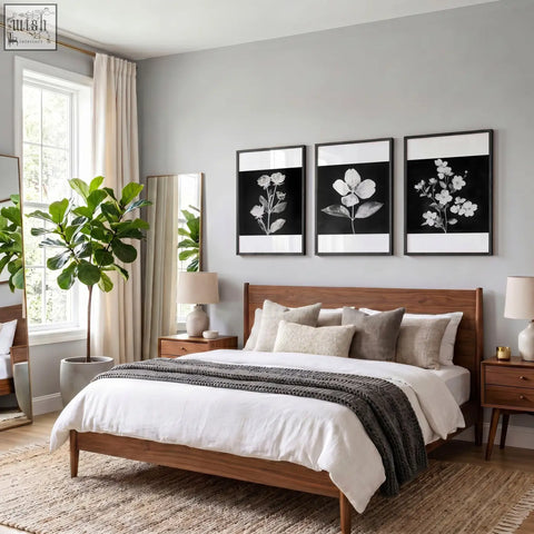 Wooden bed with medium-toned finish and matching nightstands highlighting charcoal and white floral wall art prints