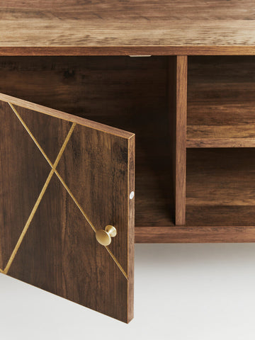 Dark wood media unit with gold geometric inlays and a round brass knob perfect for stylish storage