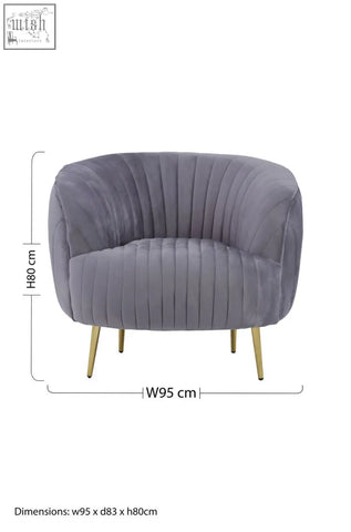 A plush florina grey velvet chair with vertical pleats and slender gold legs perfect for stylish seating