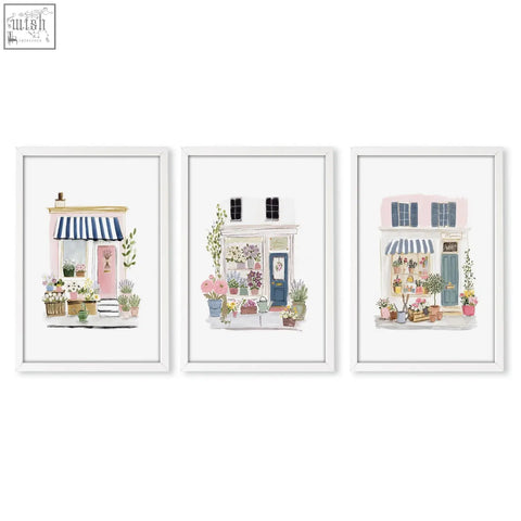 Set of 3 flower art prints featuring charming flower shop facades with pastel colors and vibrant floral arrangements