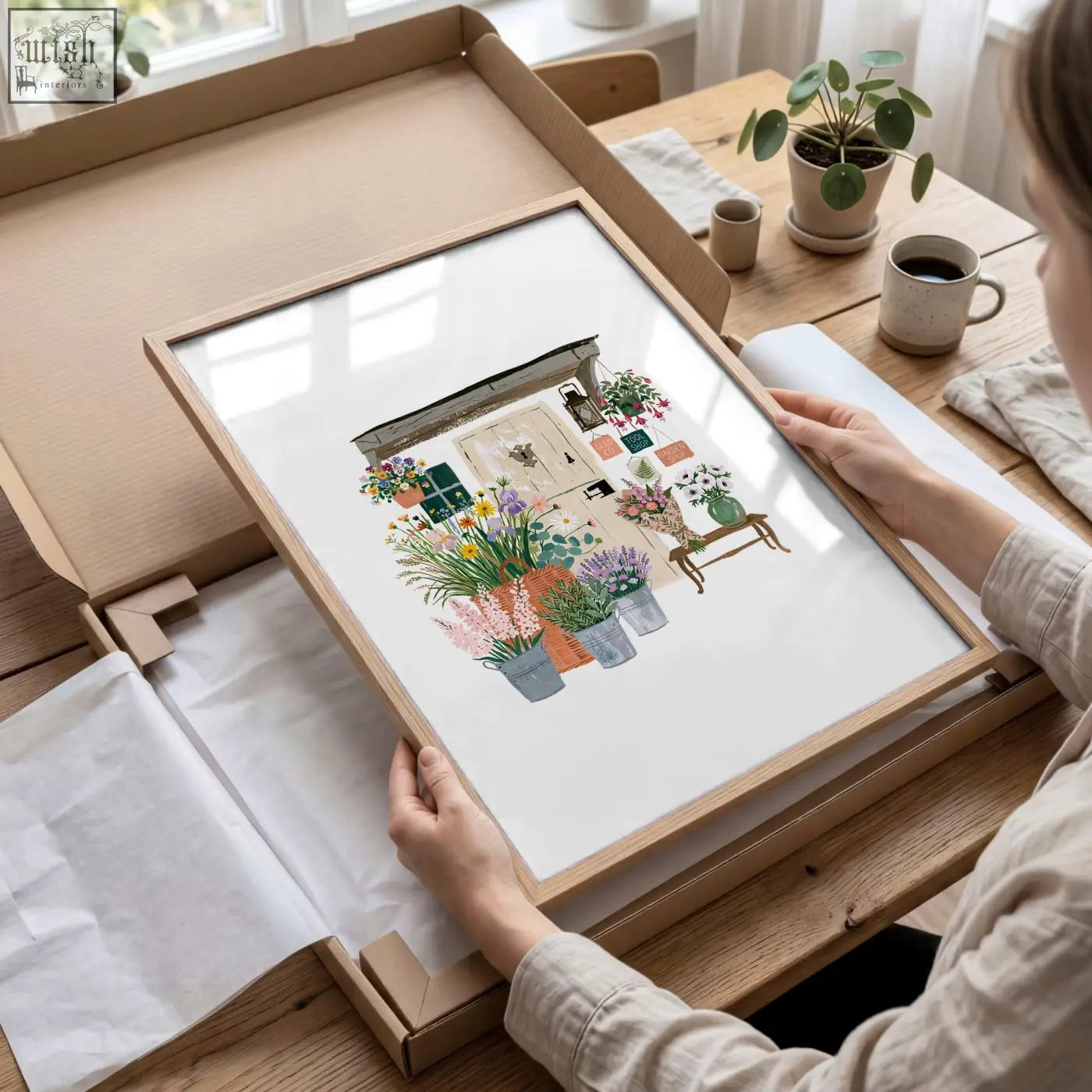 A framed watercolor flower print of a vibrant flower shop in a light wood frame perfect as wall art