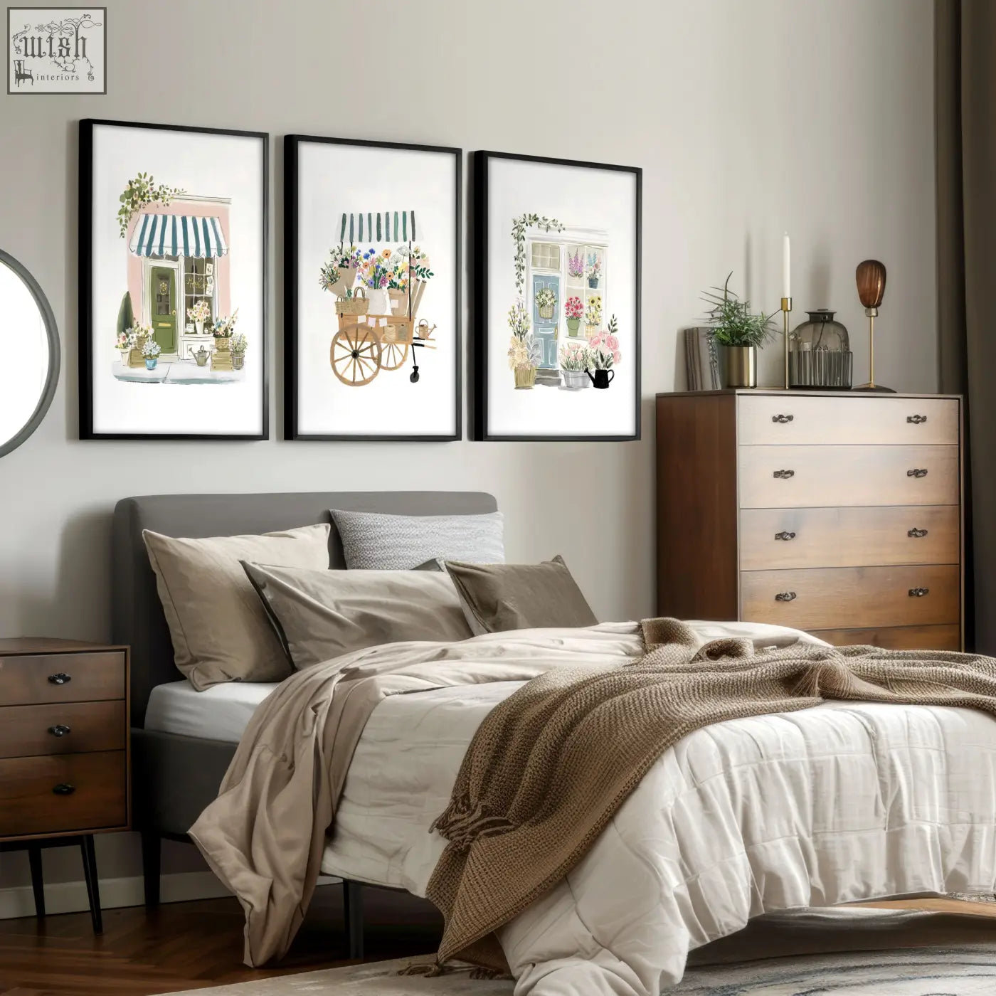 Three framed country cottage flower prints featuring delicate watercolor flower shop carts hang above the bed