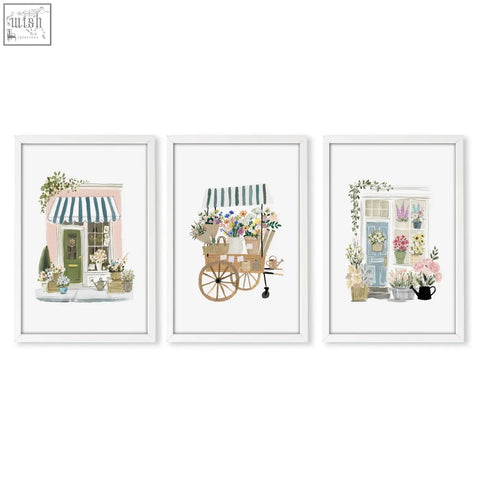Set of three white framed flower shop art prints featuring botanical flowers artwork for wall decor