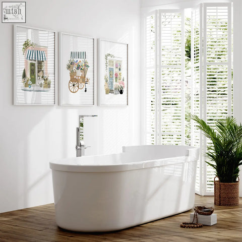 White freestanding bathtub with sleek modern design and glossy surface in flower shop flowers artwork art prints set of 3