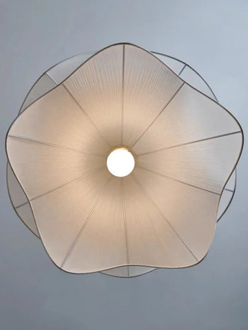 A delicate cream-colored flowers cloth chandelier lampshade with textured pattern and metallic trim for pendant lights