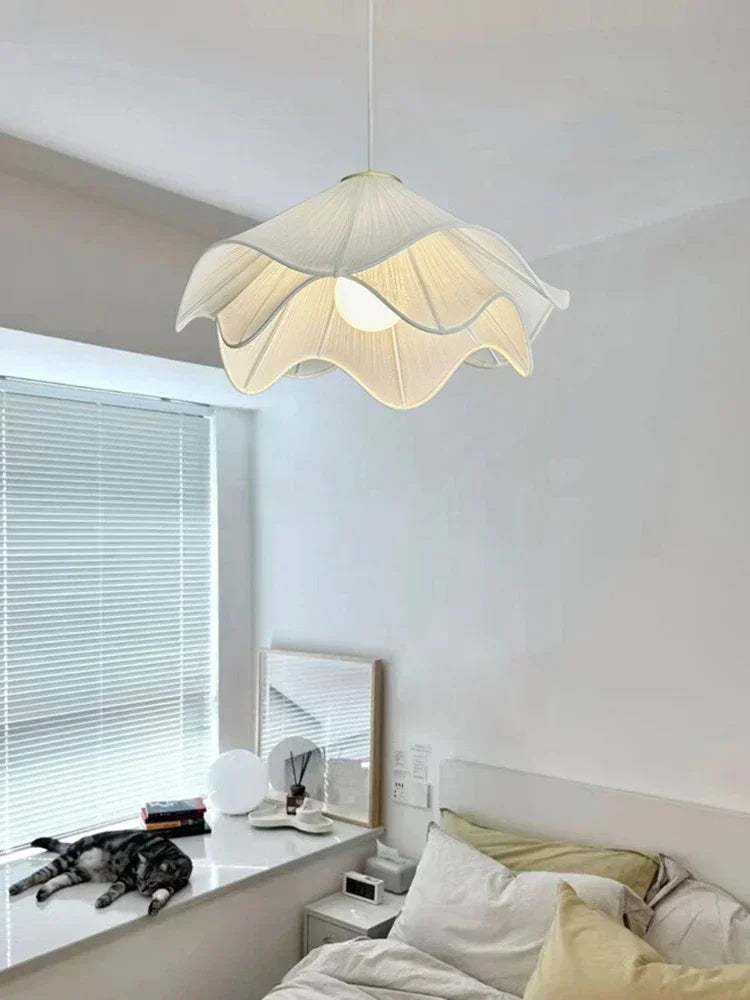 A delicate off-white flowers cloth chandelier pendant light with ruffled petal design for cozy home decor