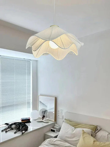 A delicate off-white flowers cloth chandelier pendant light with ruffled petal design for cozy home decor