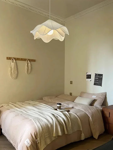 A white flowers cloth chandelier pendant light with a ruffled petal design perfect for home decoration