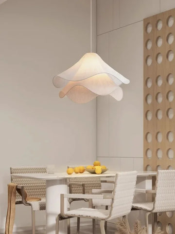 A soft off-white flowers cloth chandelier pendant light with layered petal design for home decoration