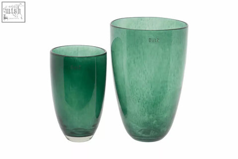 Two mouth blown emerald green dutz collection glass vases with bubbly textured surface and clear bases