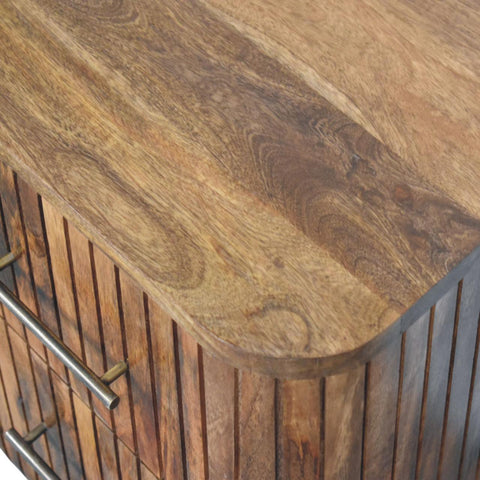 Fluted bedside table with drawers featuring a rustic wooden cabinet with warm brown finish and vertical slat detailing