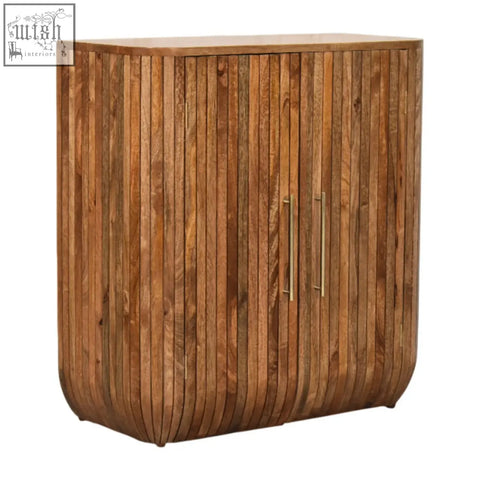 Rustic mango wood fluted curve chest of drawers with vertical slats and brass handles showing natural grain patterns