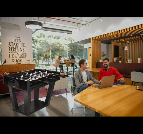 Black foosball table with metallic players and sleek modern design perfect for fun indoor games