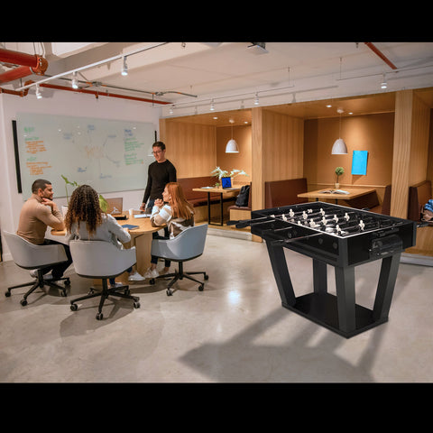 Black foosball table with white player figures featuring a sleek modern design for fun indoor play