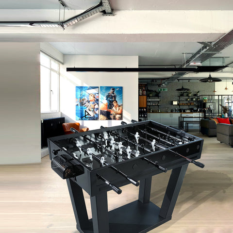 Black foosball table with white player figures and chrome rods perfect for indoor game rooms and parties