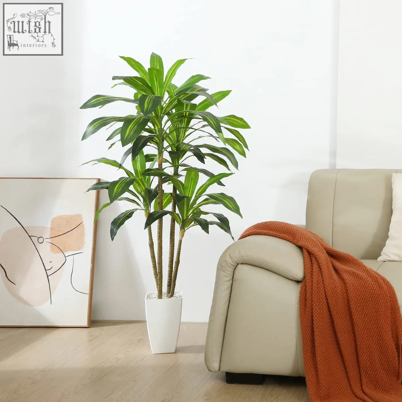 Tall artificial dracaena tree with vibrant green leaves and brown stems in a sleek white ceramic pot for indoor use