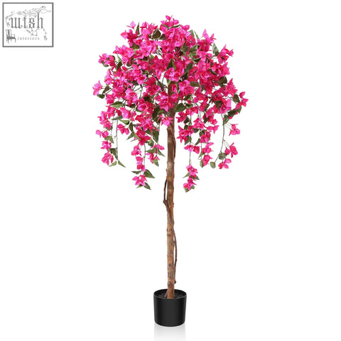 A vibrant pink fopamtri artificial blossom tree with lush green leaves in a sleek black pot for home decor