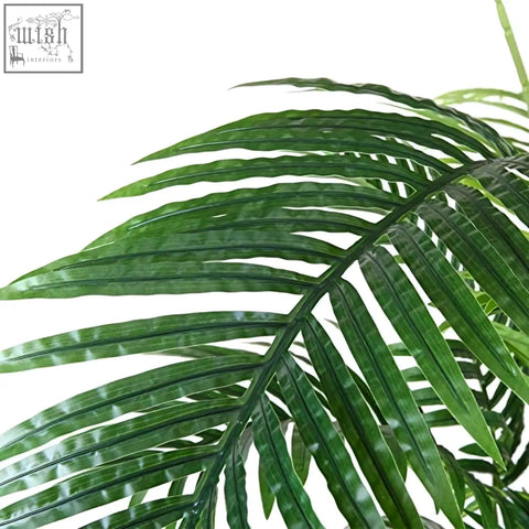 A lush deep green areca artificial palm with slender leaflets in a plastic pot from fopamtri artificial plants