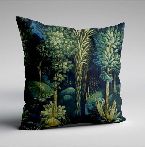 Square throw pillow with forbidden forest velvet featuring green and teal stylized trees on a deep navy background