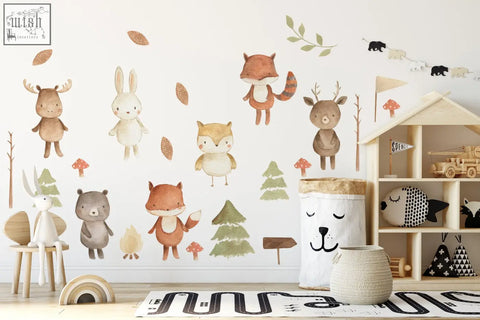 Wooden toy house with open shelves and small flag on top next to forest animals nursery wall decal stickers