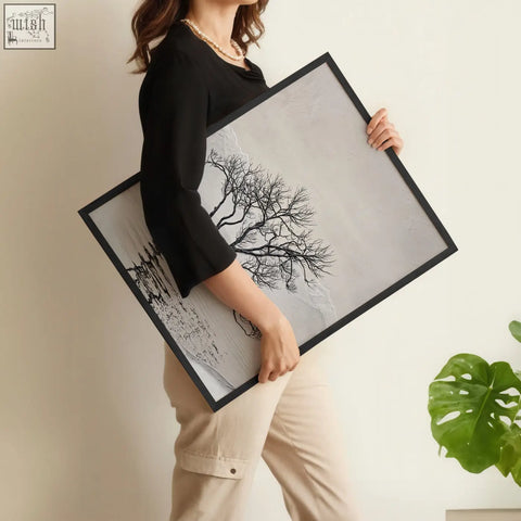 Black-framed forest art wall art print featuring minimalist black tree silhouette on textured gray background