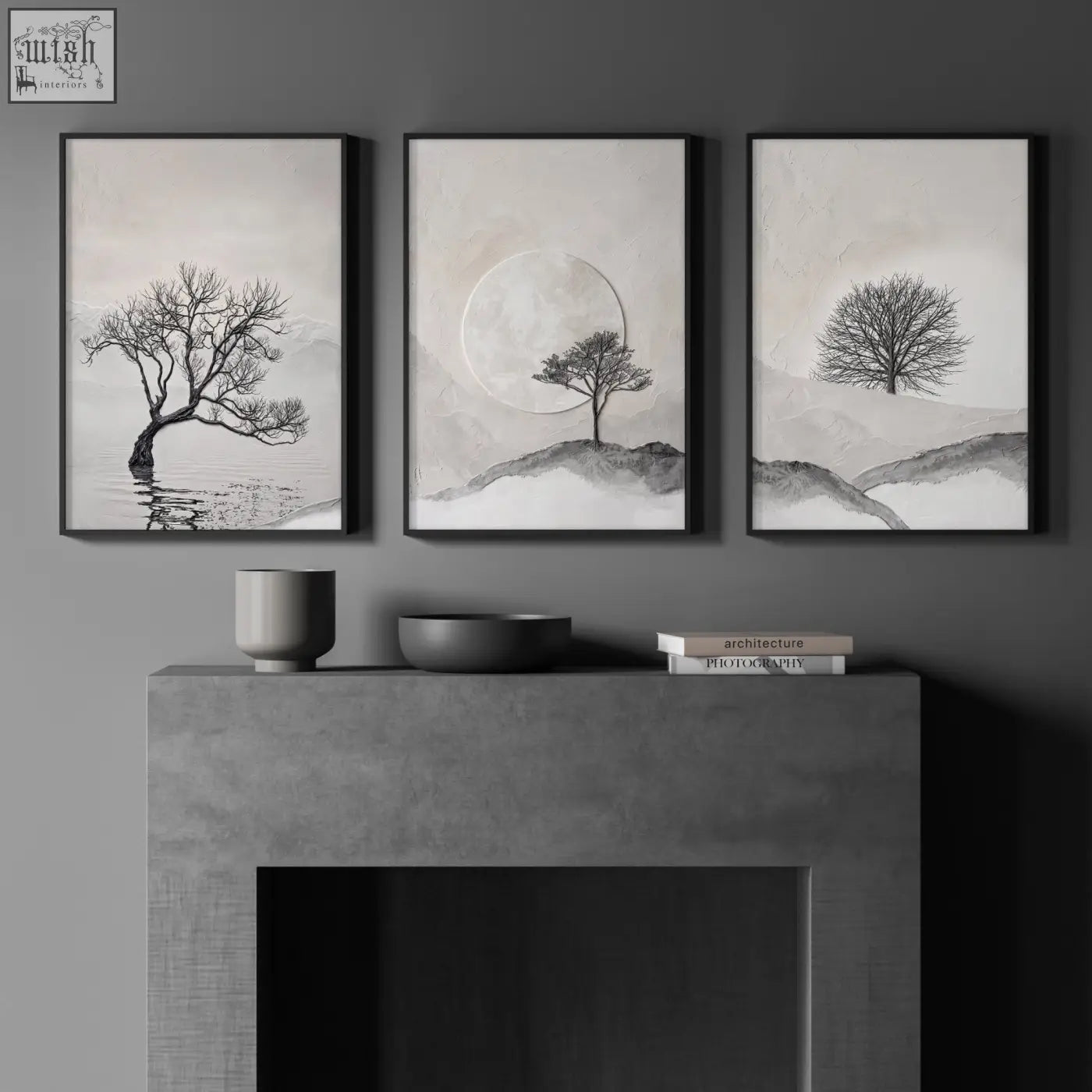 Three minimalist black framed forest art prints featuring monochrome trees and moon scenes hang above a concrete mantel wall art