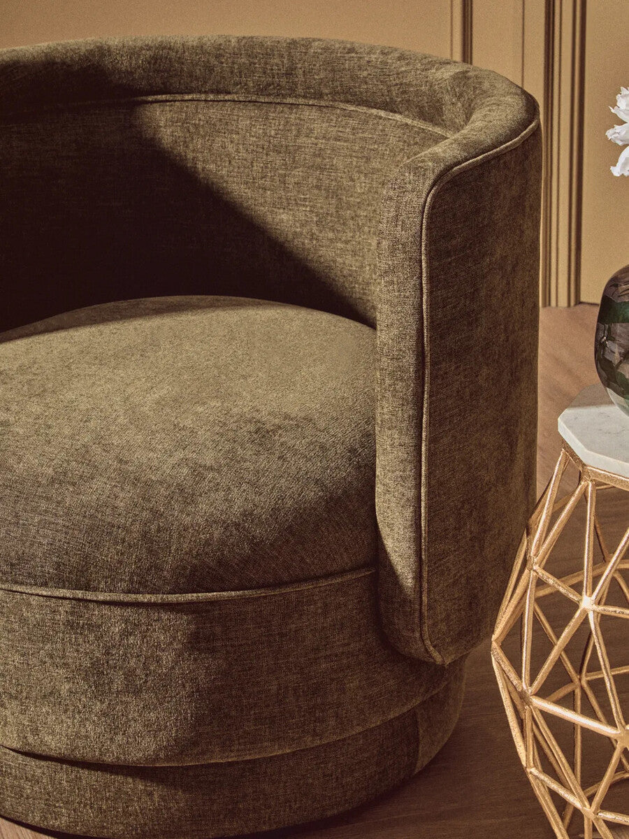 Forest green chenille effect accent chair with olive-green velvet, plush rounded design, and subtle stitched detailing