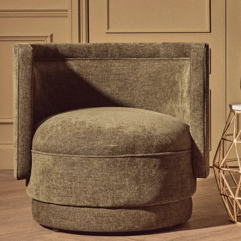 A forest green chenille effect accent chair with a plush velvet finish, rounded seat, and high backrest