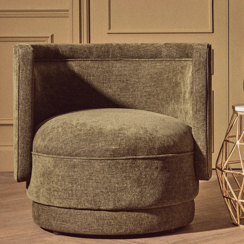 A forest green chenille effect accent chair with a plush velvet finish, rounded seat, and high backrest