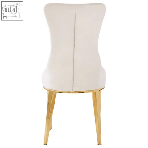Forli white dining chair with cream upholstery and slender gold finish stainless steel legs