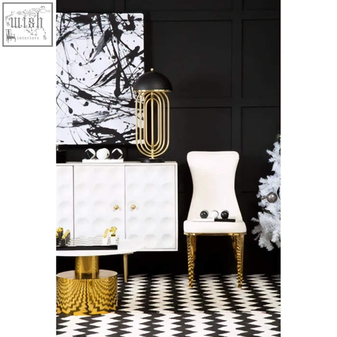 Forli white dining chair with gold finish stainless steel legs and a gold-toned paperclip-shaped lamp with black shade