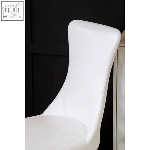 Forli white dining chair with smooth faux leather upholstery and sleek finish stainless steel legs