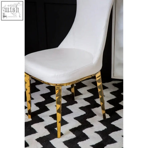 Forli white dining chair with white upholstered seat and gold finish stainless steel legs with geometric accents